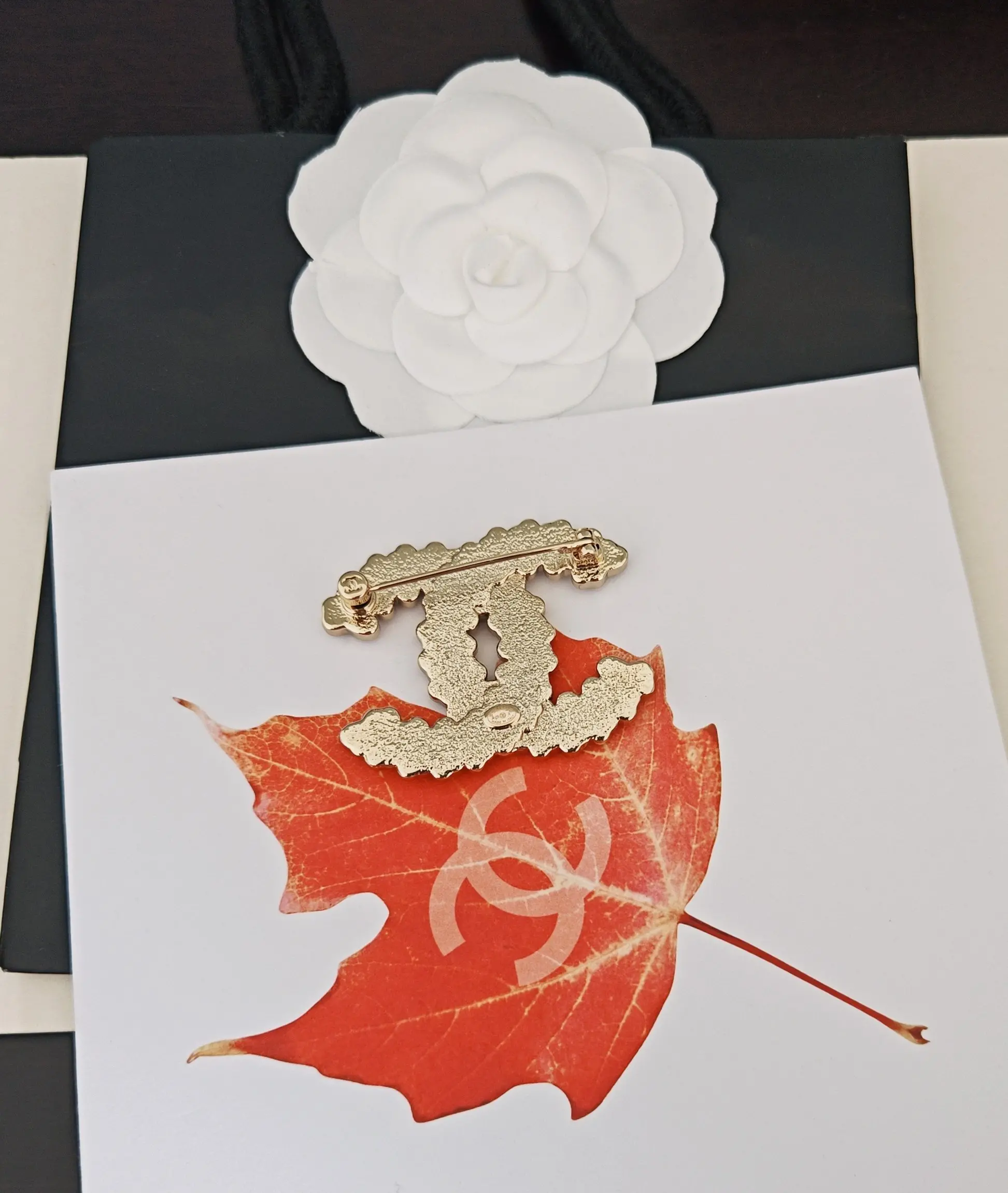 Chanel Gold CC Logo Brooch on Red Maple Leaf