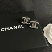 Chanel Stylish CC Snake Stud Earrings