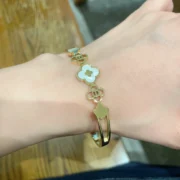 Chanel Stylish Clover Bracelet in Gold Tone