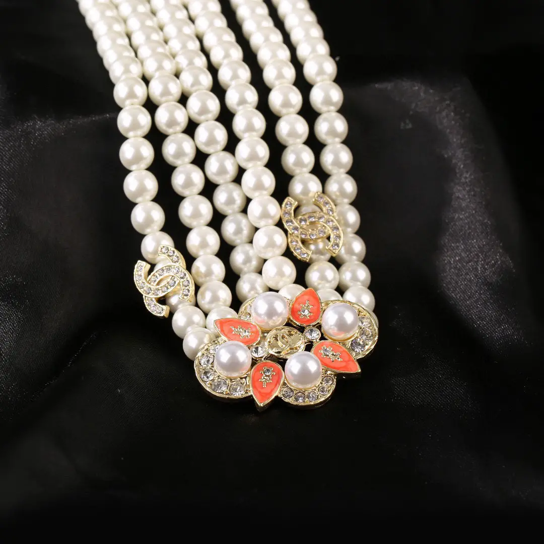Chanel Unique Pearl Necklace with Coral Brooch